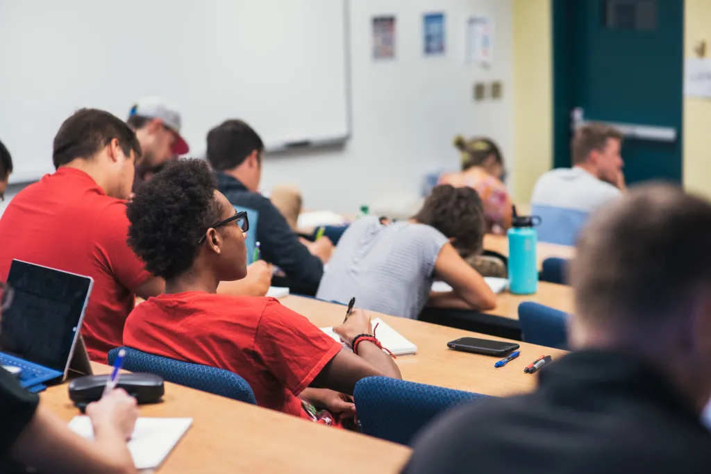 photo of students taking notes in class